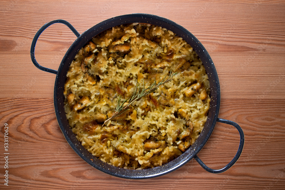 Mountain rice cooked in the oven in paella. Typical tapa recipe with pork and rabbit meat. Mountain rice cooked in the oven in paella. Typical tapa recipe with pork and rabbit meat.