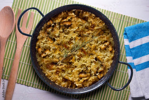 Mountain rice cooked in the oven in paella. Typical tapa recipe with pork and rabbit meat.