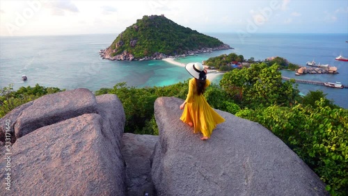 Beautiful girl walking on viewpoint at Koh Nangyuan island near Koh Tao island, Surat Thani in Thailand. photo
