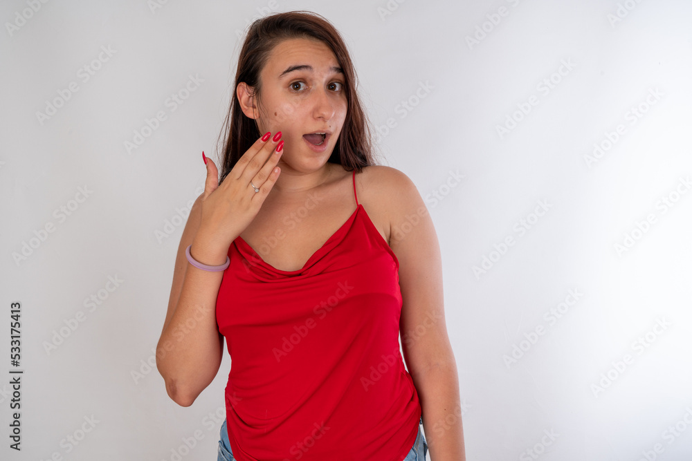 Woman posing on isolated white background, selective focus shot. Woman posing on isolated white background, selective focus shot.