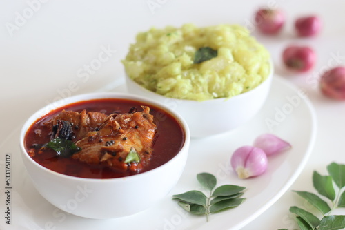 Indian butter fish curry prepared in kerala style served with Mashed tapioca photo