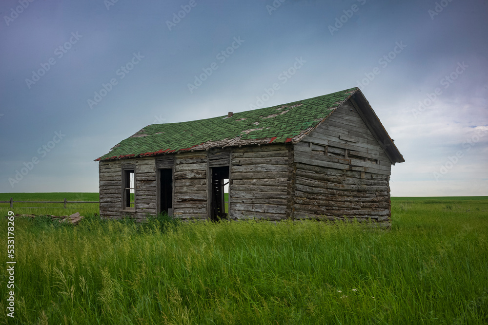 Old Farmhouse in the middle of the grasslands of North Dakota Old Farmhouse in the middle of the grasslands of North Dakota