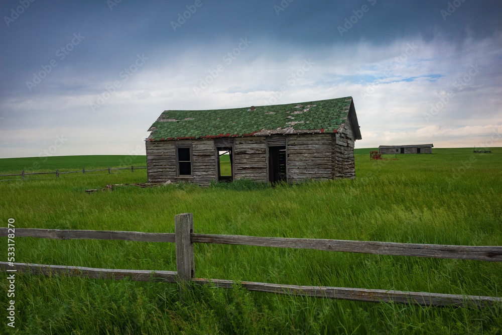Old Farmhouse in the middle of the grasslands of North Dakota