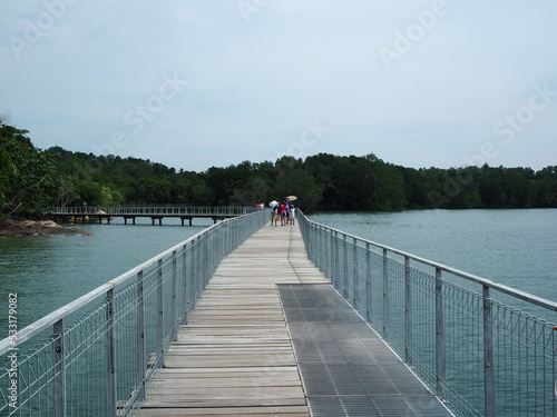 Boardwalk overlooking sea in Chek Jawa, Pulau Ubin, Singapore photo