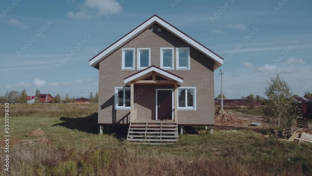 Aerial photography of a new house in a Russian village, newly built private house, construction of houses Aerial photography of a new house in a Russian village, newly built private house, construction of houses