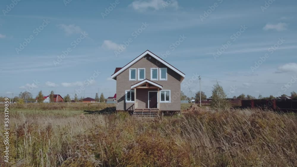 Aerial photography of a new house in a Russian village, newly built private house, construction of houses Aerial photography of a new house in a Russian village, newly built private house, construction of houses