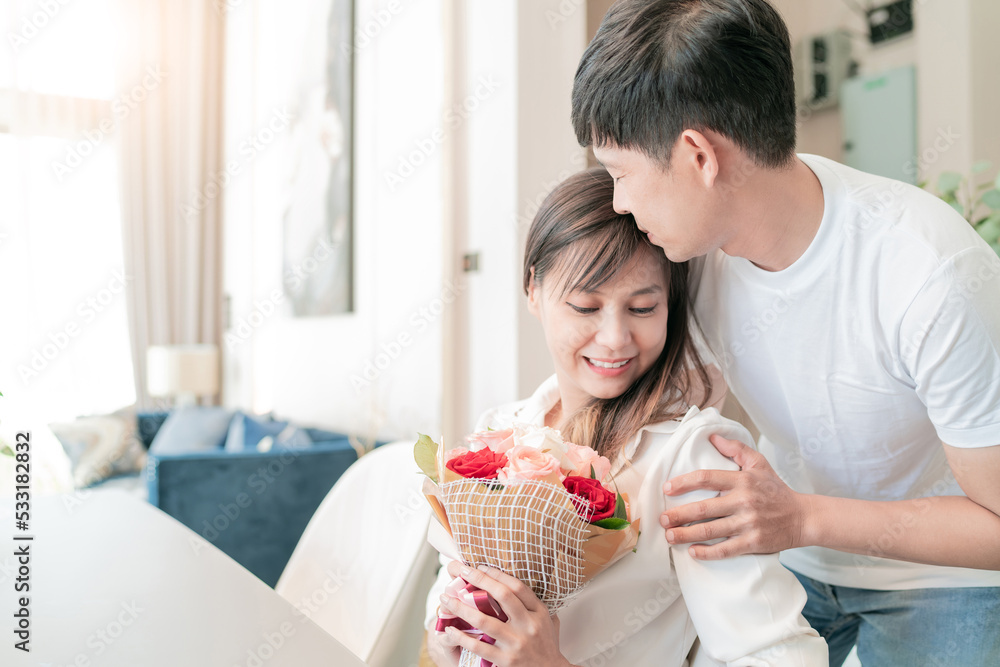 handsome husband giving flowers to beautiful wife. happy family living together giving present. good relax man give gift for fun woman. lovely boyfriend surprised cute girlfriend with bouquet gift handsome husband giving flowers to beautiful wife. happy family living together giving present. good relax man give gift for fun woman. lovely boyfriend surprised cute girlfriend with bouquet gift