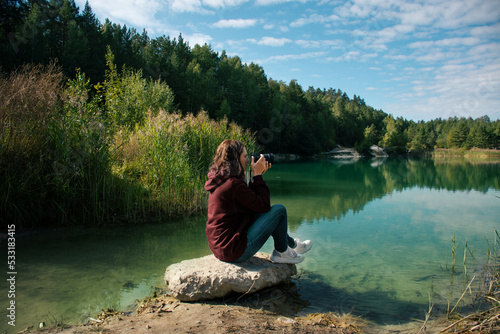 woman photographing the landscape