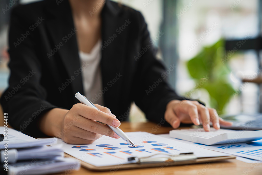 cropped shot view of a bookkeeper or financial inspector hands making a report, calculating or checking balance. Home finances, investment, economy concept cropped shot view of a bookkeeper or financial inspector hands making a report, calculating or checking balance. Home finances, investment, economy concept