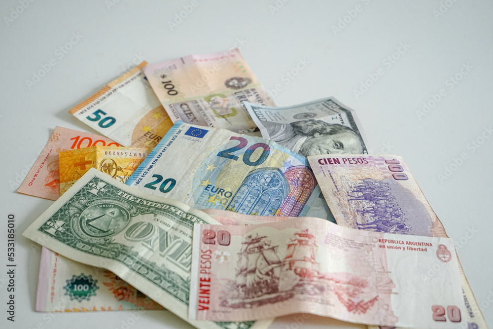 Fototapeta premium Banknotes from different currencies on white background