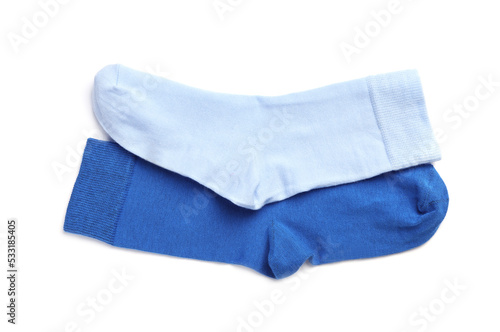 Different blue socks on white background, top view
