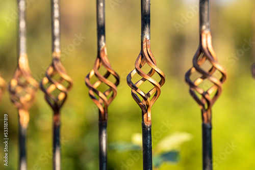 Decorative element of forged metal lattice fence