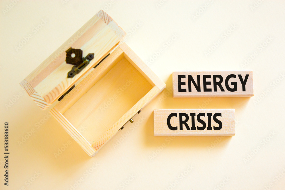 Global energy crisis symbol. Concept words Energy crisis on wooden blocks. Beautiful white table white background. Empty wooden chest. Business global energy crisis concept. Copy space. Global energy crisis symbol. Concept words Energy crisis on wooden blocks. Beautiful white table white background. Empty wooden chest. Business global energy crisis concept. Copy space.