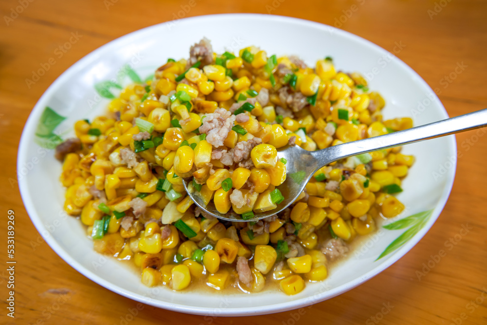A dish of delicious Chinese home cooking, fried corn with minced meat A dish of delicious Chinese home cooking, fried corn with minced meat