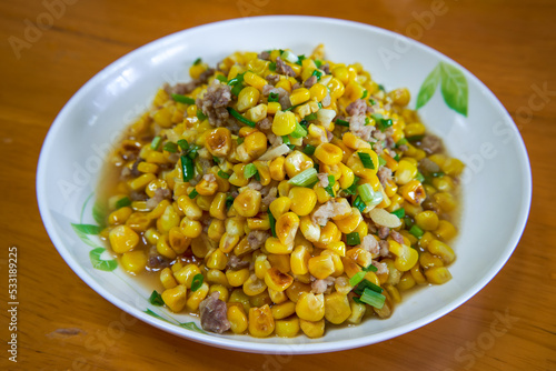 A dish of delicious Chinese home cooking, fried corn with minced meat