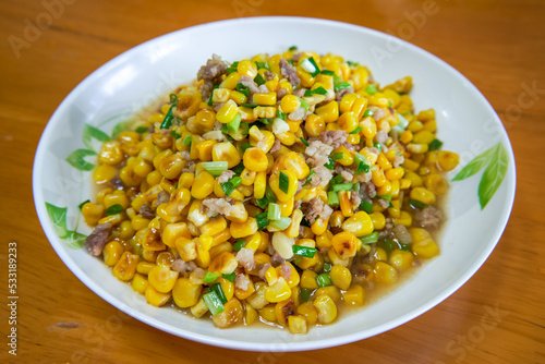 A dish of delicious Chinese home cooking, fried corn with minced meat