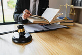 Attorneys or lawyers businessman working or reading lawbook in office workplace for consultant lawyer concept.