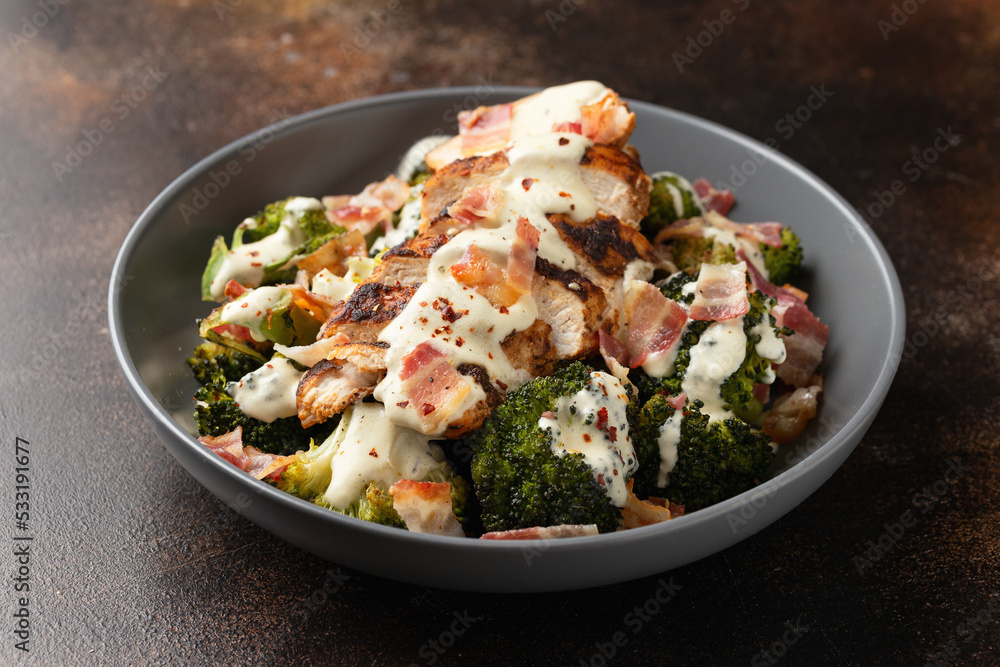 Baked chicken, broccoli with creamy cheese sauce and bacon Baked chicken, broccoli with creamy cheese sauce and bacon