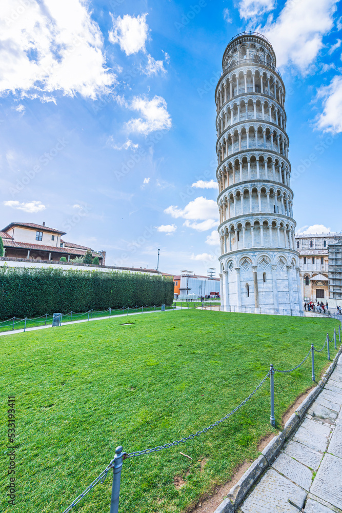 The Pisa's Cathedral and The Leaning Tower of Pisa  is a medieval structure. The bell tower was built in 1173 in white marble, Italy, 2019