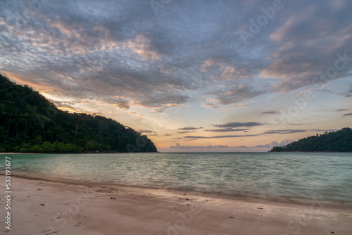 Beautiful sunset at Mai ngam beach in Koh Surin national park, the famous free driving spot in Pang Nga, Thailand.