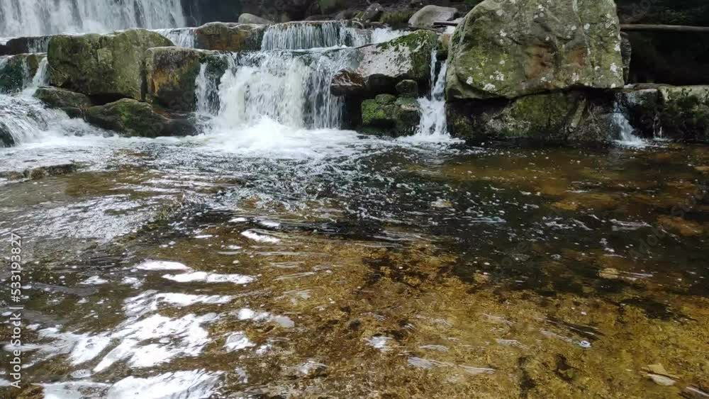Stream waterfall on rocks in the forest. Waterfall stream on rocks. Beautiful waterfall stream. Waterfall stream in forest. Karpacz , Poland Stream waterfall on rocks in the forest. Waterfall stream on rocks. Beautiful waterfall stream. Waterfall stream in forest. Karpacz , Poland