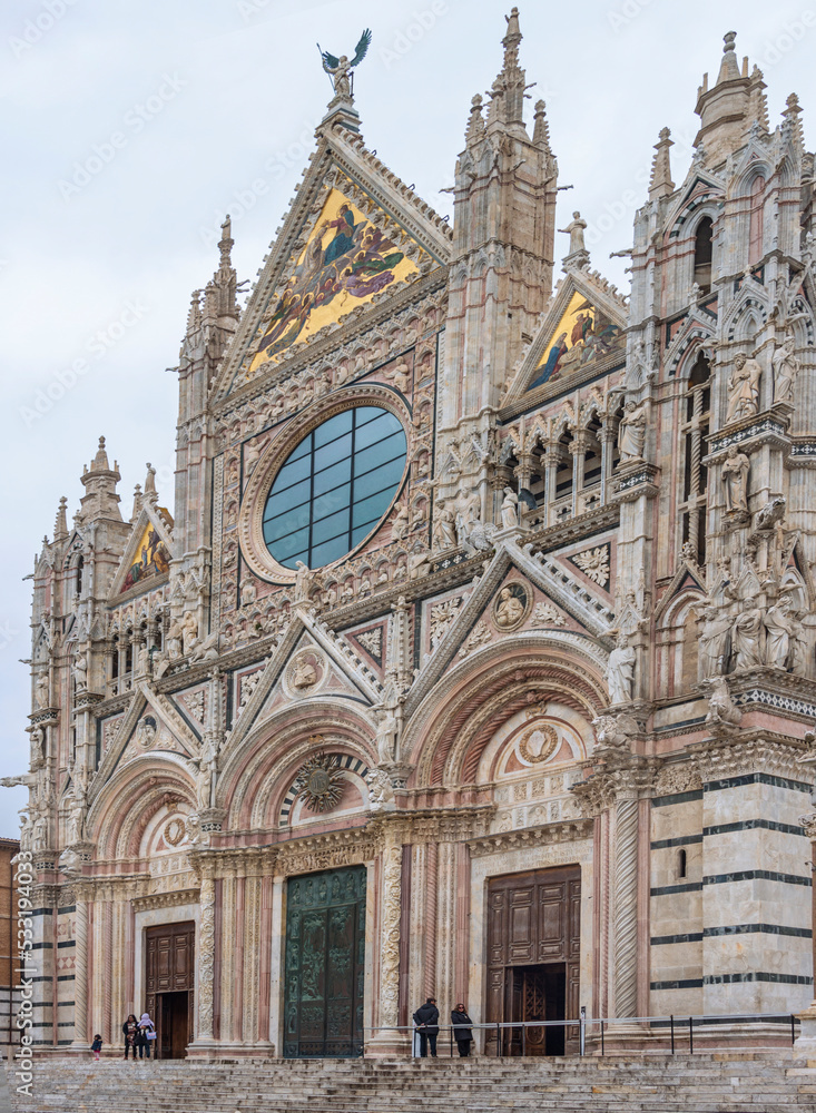 Facade of the Siena Cathedral. It's a medieval church dedicated from its earliest days as Roman Catholic Marian church. The cathedral was completed in 1263. Italy, 2019