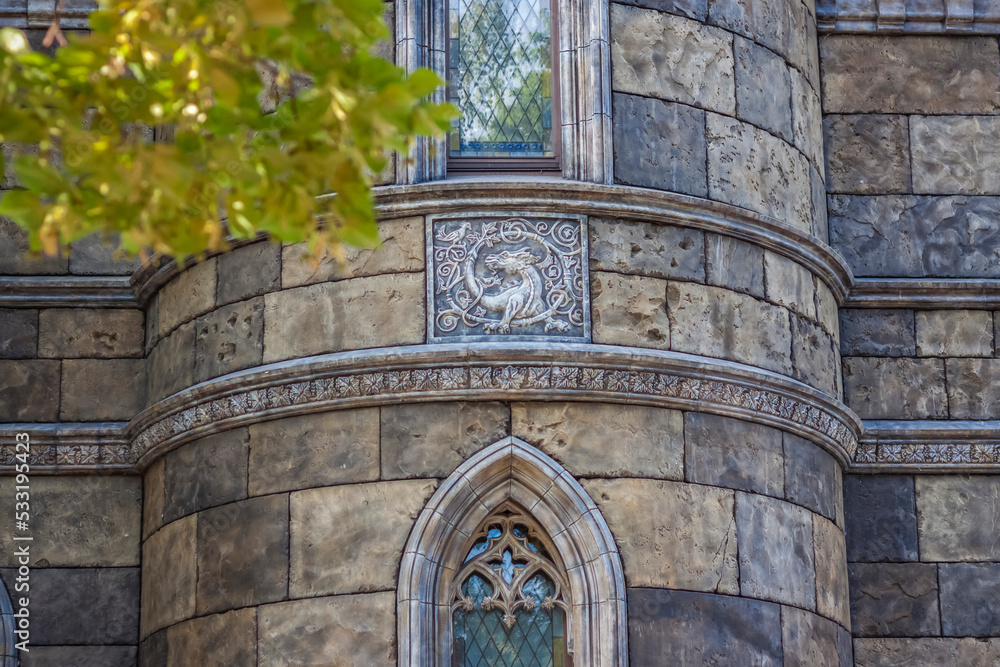 Obraz premium Antiquity in detail. Decoration of houses, balconies, windows, sculptures, walls. Elements of architectural design of buildings. Old plaster, Stone decorations. Elements of Gothic architecture