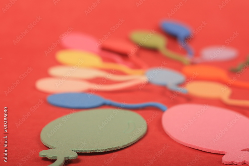 colorful balloons on red background
colorful balloons on red background