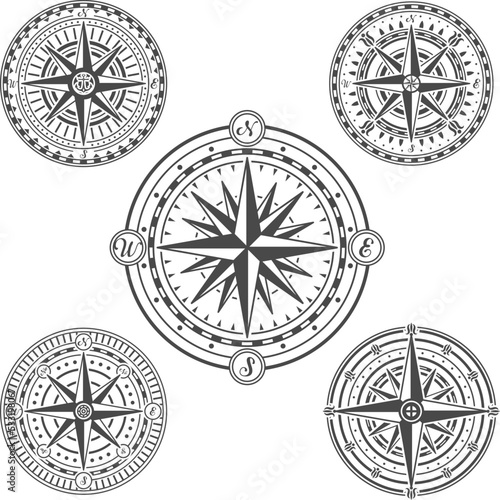 Composed vector icons of nautical navigating compasses isolated on white.
