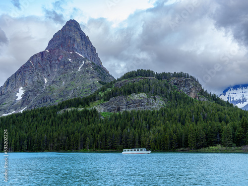 Montana Lake with mountains and passenger boat photo