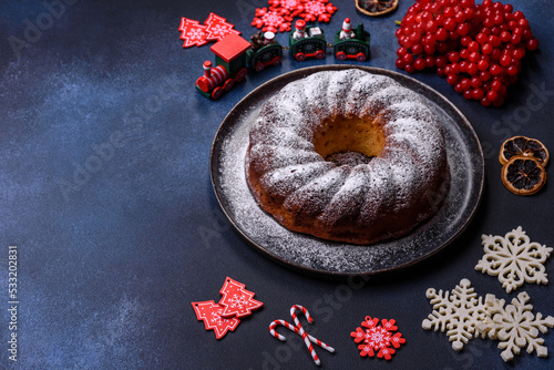 Homemade delicious round Christmas pie with red berries on a ceramic plate