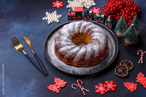 Homemade delicious round Christmas pie with red berries on a ceramic plate