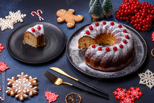 Homemade delicious round Christmas pie with red berries on a ceramic plate