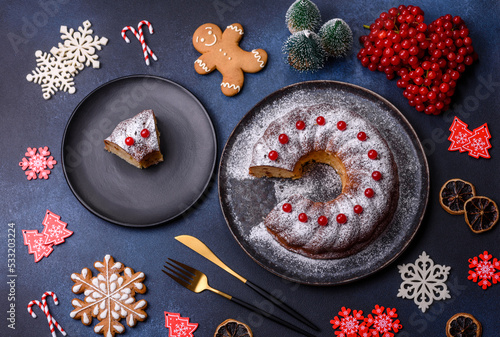 Homemade delicious round Christmas pie with red berries on a ceramic plate
