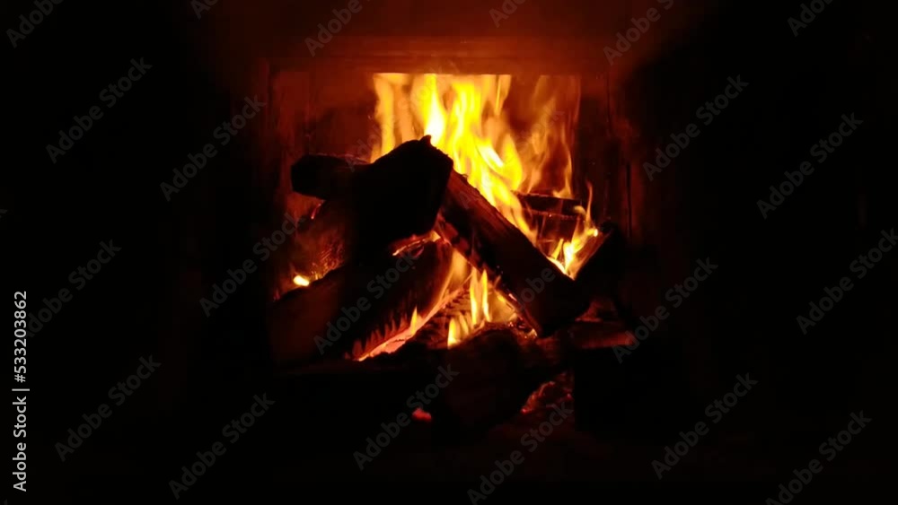 The stove with firewood in the bath flares up The stove with firewood in the bath flares up