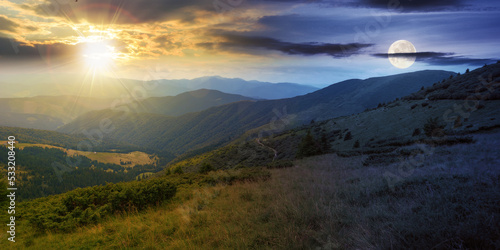 carpathian mountain range in summer at twilight. day and night time change concept. landscape with forested hills and grassy meadows rolling down in to the valley beneath a sky with sun and moon © Pellinni