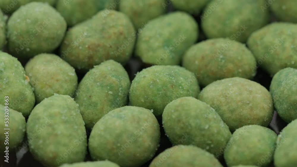 nuts with wasabi rotate in a circle. spicy snack nuts with wasabi rotate in a circle. spicy snack