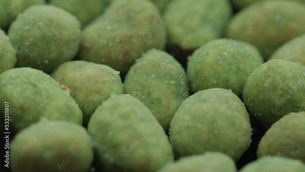 nuts with wasabi rotate in a circle. spicy snack nuts with wasabi rotate in a circle. spicy snack