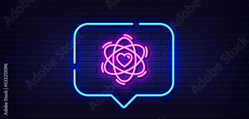 Neon light speech bubble. Atom with heart line icon. Energy sign. Chemical element symbol. Neon light background. Atom glow line. Brick wall banner. Vector