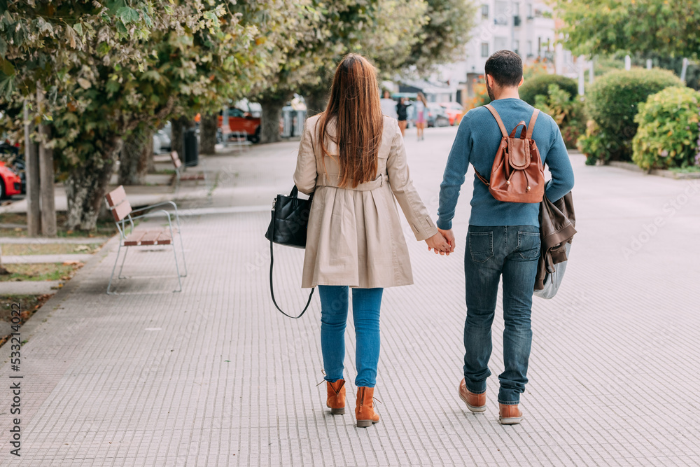 couple walking in autumn in the city or on a trip couple walking in autumn in the city or on a trip