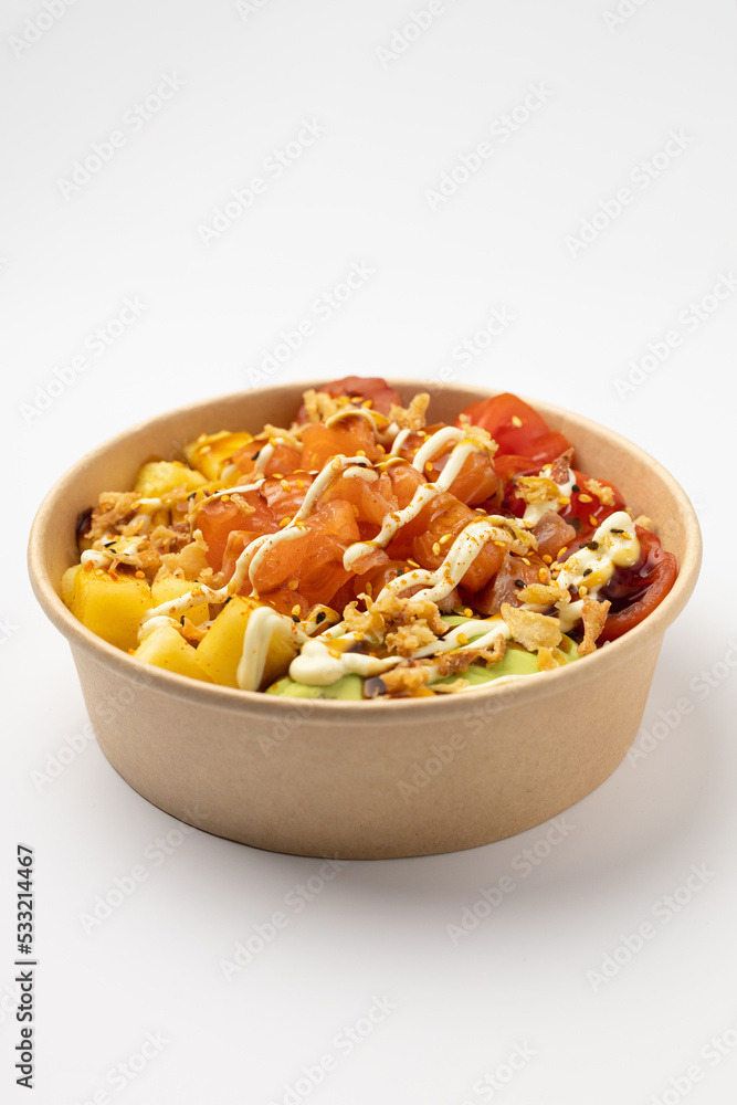 Poke with salmon, pineapple and avocado with spicy sauce on a white background Poke with salmon, pineapple and avocado with spicy sauce on a white background