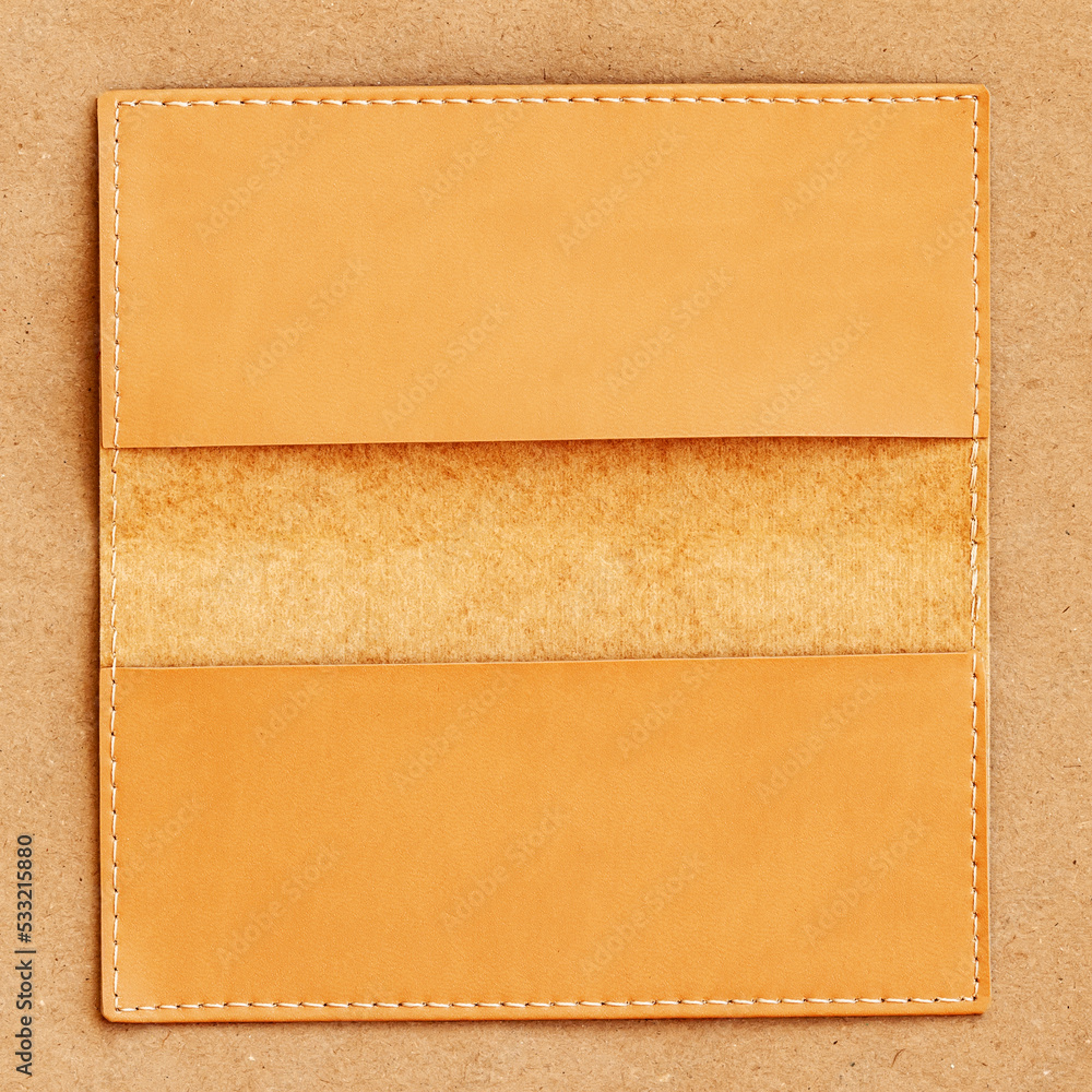 Obraz premium Close-up of opened leather wallet, purse on wooden surface