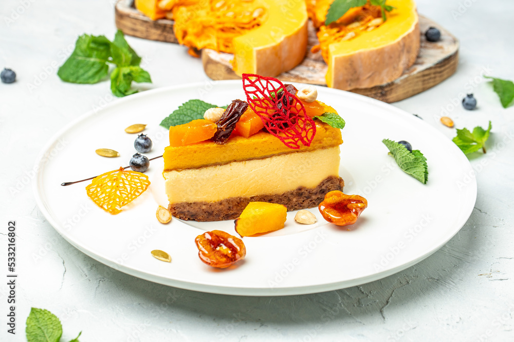 Cheesecake dessert with nuts on a light background. top view Cheesecake dessert with nuts on a light background. top view