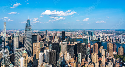 New York skyline, panoramic view with skyscrapers in Midtown Manhattan with blue sky photo