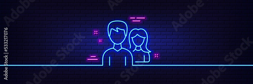 Neon light glow effect. Group line icon. Users or Teamwork sign. Male and Female Person silhouette symbol. 3d line neon glow icon. Brick wall banner. Teamwork outline. Vector