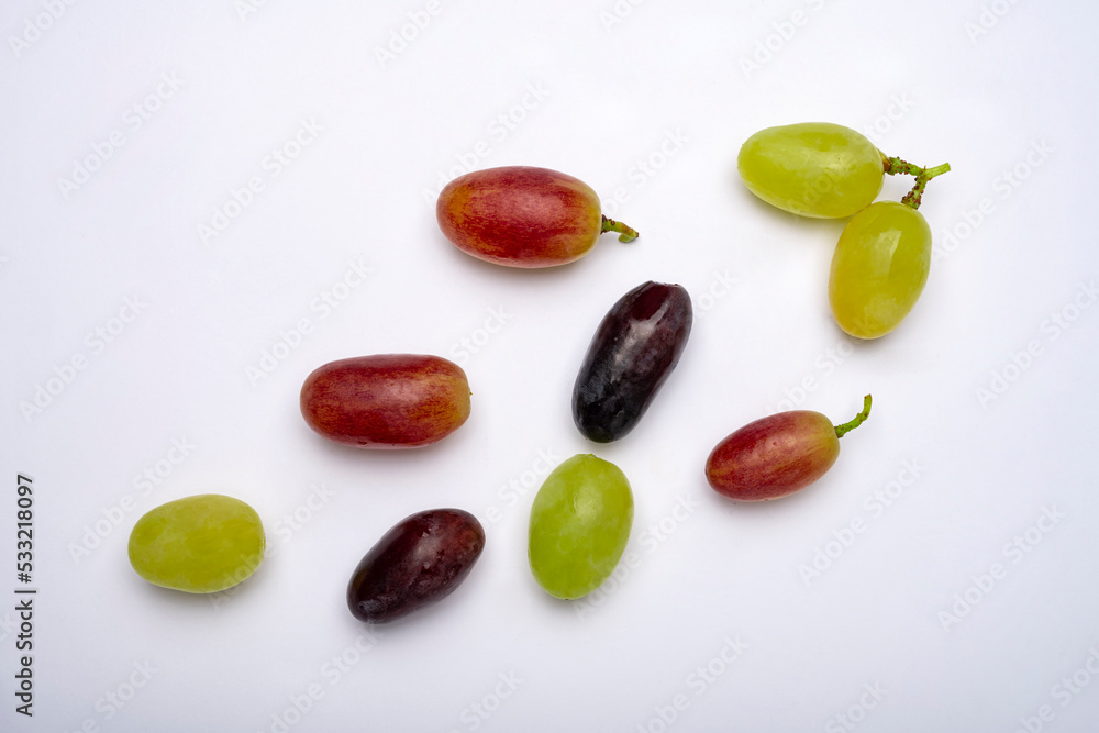 Various grapes are on the table. Isolated vines Various grapes are on the table. Isolated vines