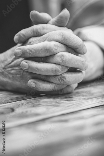 Elderly woman with folded hands. Hands of an old woman close up. © fantom_rd