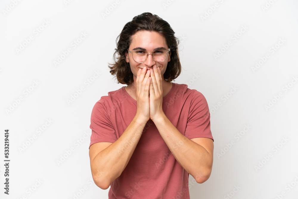 Young handsome man isolated on white background happy and smiling covering mouth with hands Young handsome man isolated on white background happy and smiling covering mouth with hands