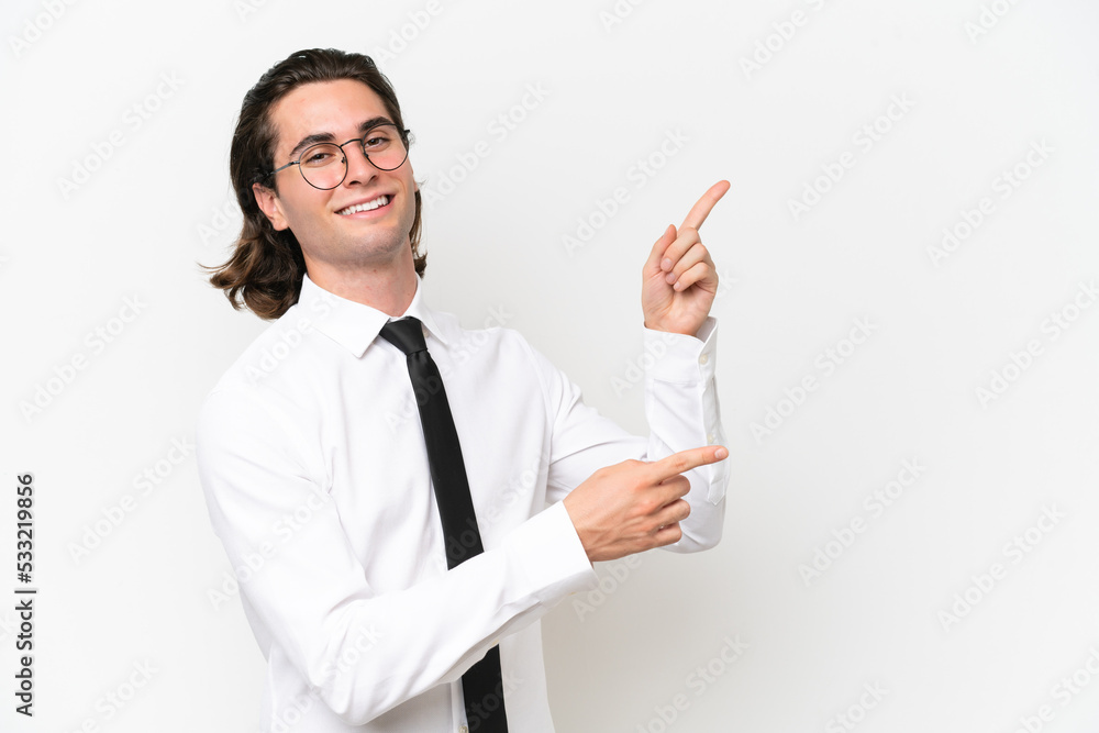 Business handsome man isolated on white background pointing finger to the side and presenting a product Business handsome man isolated on white background pointing finger to the side and presenting a product