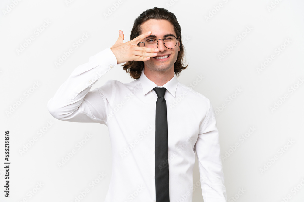 Business handsome man isolated on white background covering eyes by hands and smiling Business handsome man isolated on white background covering eyes by hands and smiling